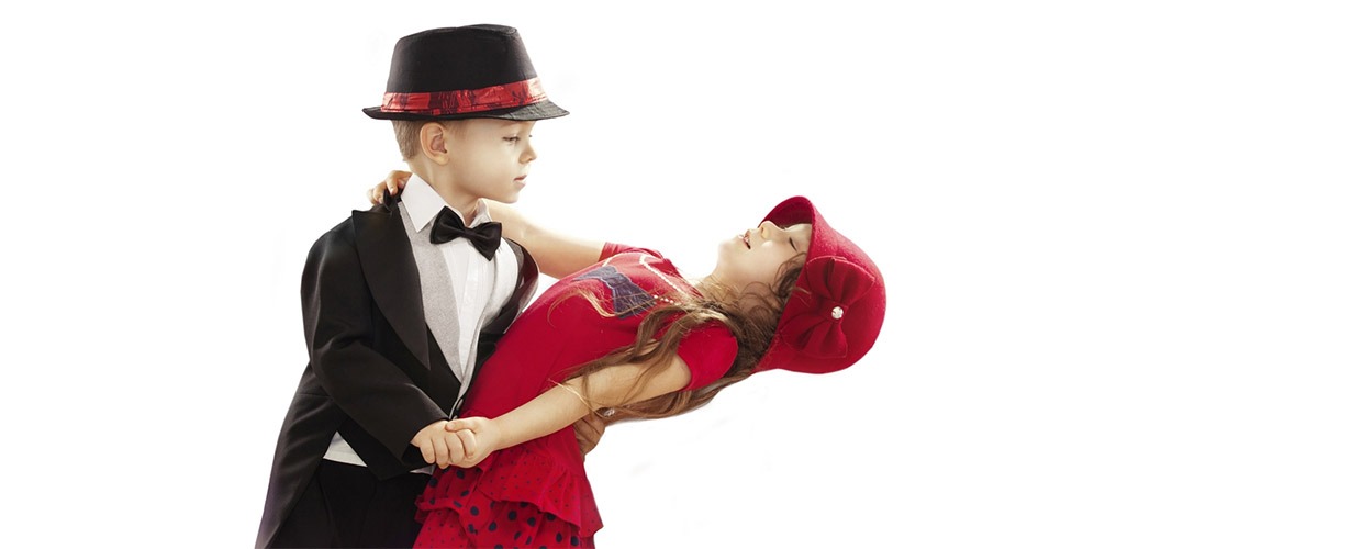 Little boy and girl ballroom dancing